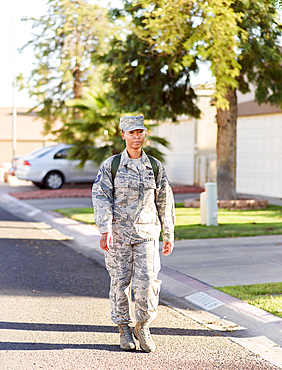 Black woman soldier walking in street