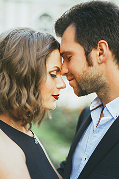 Portrait of smiling Caucasian couple touching faces