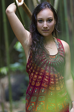 Caucasian woman standing in bamboo forest