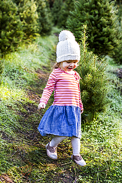 Caucasian girl walking on path