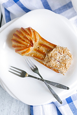 Pastry on plate with forks