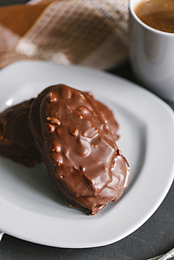 Chocolate cookies with nuts on plate