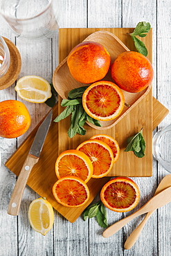 Sliced oranges on cutting board