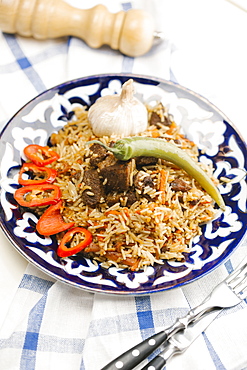 Pepper and onion on plate with beef and rice