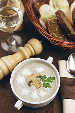 Mushroom floating in cup of soup