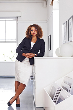 Portrait of mixed race woman in gallery