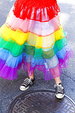 Person wearing rainbow skirt