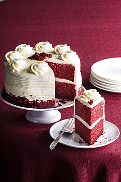 Slice of red velvet cake on plate