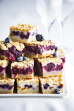 Pile of berry cobbler slices on tray