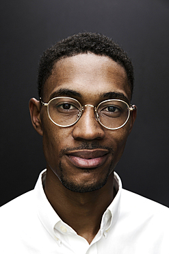 Portrait of smiling Black man wearing eyeglasses