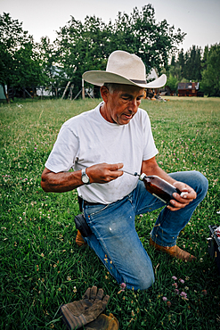 Caucasian farmer preparing vaccine in syringe