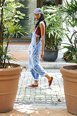 Casual Mixed Race woman walking in street