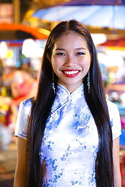 Portrait of smiling Asian woman wearing traditional clothing