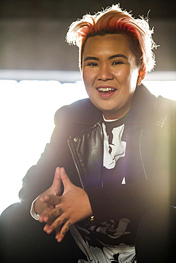 Portrait of smiling androgynous Asian woman