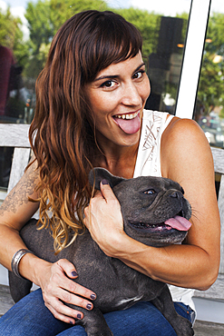 Caucasian woman imitating dog with tongue out