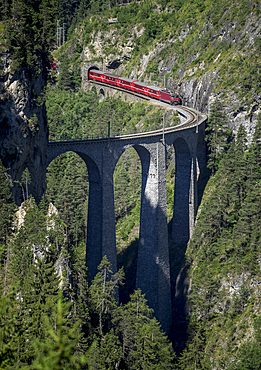 Train on mountain bridge, Filisur, Canton Graubunden, Switzerland