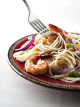 Fork twirling spaghetti with shrimp