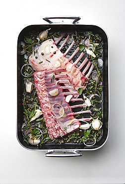 Raw racks of lamb in pan