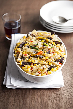 Bowl of Mexican tortilla casserole with corn