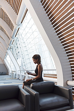 Black businesswomen reading paperwork