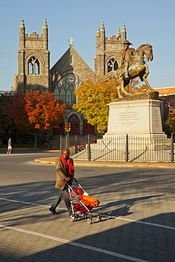 Father pushing stroller in city