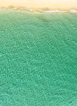 Overhead view of turquoise ocean and beach