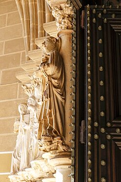 Portugal, Evora, Carved religous figures on church exterior