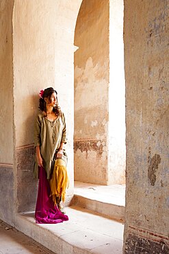 Mexico, San Felipe, Woman posing at old abandoned hacienda