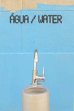 Water fountain and painting on wall