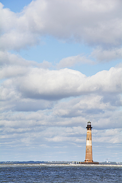 Morris Island Light against cloudy sky