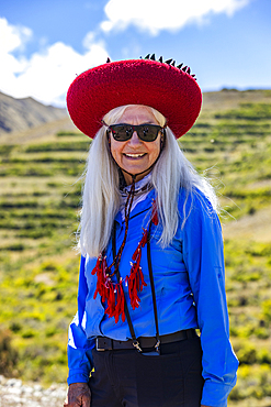 Portrait of smiling woman wearing local ceremonial garb