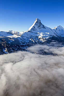 Fog revealing the mountain range surrounding the massif of the Matterhorn, Swiss Canton of Vaais, Swiss Alps, Switzerland, Europe