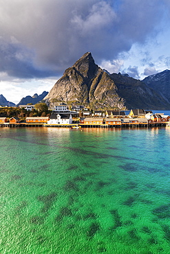 Town of Sakrisoy under Olstinden mountain in Reine, Norway, Europe