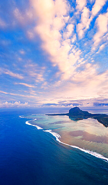 Sunrise over Le Morne and coral reef in the turquoise lagoon, aerial view by drone, Baie Du Cap, South Mauritius, Indian Ocean, Africa