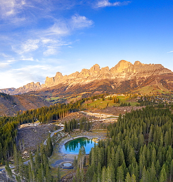 Aerial view of deforestation surrounding Carezza Lake after the violent Vaia storm, Dolomites, South Tyrol, Italy, Europe