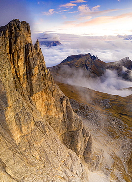 Aerial view by drone of autumn sunset over Lastoi De Formin, Mondeval and Monte Pelmo, Giau Pass, Dolomites, Belluno, Veneto, Italy, Europe