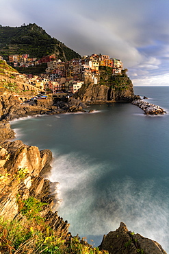 Waves crashing on cliffs next to Manarola, Cinque Terre, UNESCO World Heritage Site, La Spezia province, Liguria, Italy, Europe