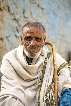 Portrait of Ethiopian senior man with traditional clothing and stick, Abala, Afar Region, Ethiopia, Africa