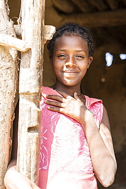 Little girl smiling from hut in Abala village, Afar Region, Ethiopia, Africa