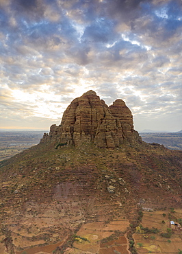 Clouds at sunset over the tall rocks of Gheralta Mountains, aerial view by drone, Hawzen, Tigray Region, Ethiopia, Africa