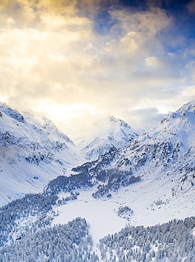 Aerial view of Lake Cavloc and woods covered with snow, Bregaglia Valley, Engadine, canton of Graubunden, Switzerland, Europe