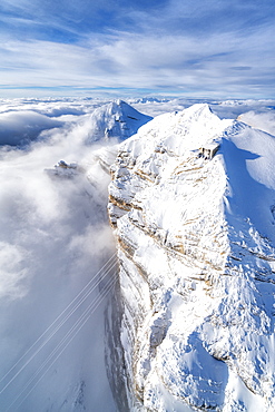 Aerial view of snow capped Tofane group and scenic Freccia nel Cielo cableway, Dolomites, Belluno province, Veneto, Italy, Europe