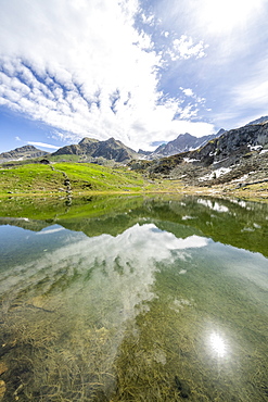 Sunlight over mountain peaks overlooking Porcile Lakes, Tartano Valley, Valtellina, Sondrio province, Lombardy, Italy, Europe