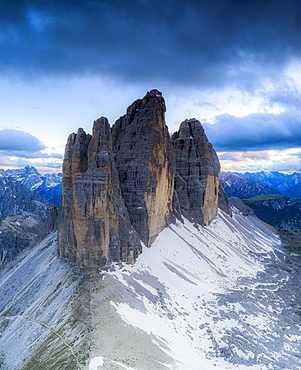 Clouds over the majestic peaks of Tre Cime di Lavaredo, aerial view, Sesto Dolomites Natural Park, South Tyrol, Italy, Europe