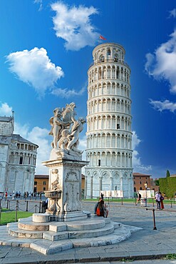 Tourists admiring the Renaissance fountain and the Leaning Tower of Pisa in summer, UNESCO World Heritage Site, Pisa, Tuscany, Italy, Europe