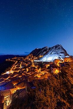 Stars in the night sky over the medieval town of Pietrapertosa, Dolomiti Lucane, Potenza province, Basilicata, Italy, Europe