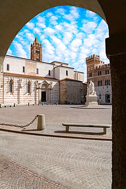 San Lorenzo Cathedral (Duomo) and Canapone monument statue viewed from the old arcade, Grosseto, Tuscany, Italy, Europe