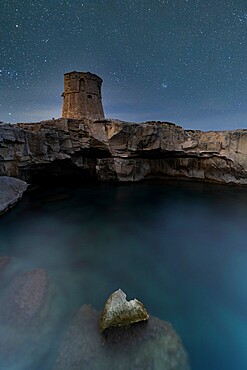 Starry sky over Torre Miggiano tower on cliffs above the sea, Santa Cesarea Terme, Porto Miggiano, Lecce, Salento, Apulia, Italy, Europe