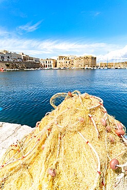 Fishing nets in the harbor surrounded by old town and castle by the sea, Gallipoli, Lecce province, Salento, Apulia, Italy, Europe