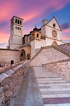 Pink sunrise over the Papal Basilica of Saint Francis in Assisi, UNESCO World Heritage Site, Perugia province, Umbria, Italy, Europe